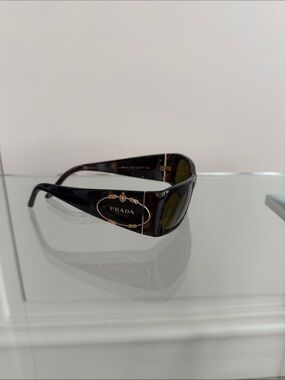 Prada Women’s Tortoiseshell Sunglasses with Gold Logo Accent